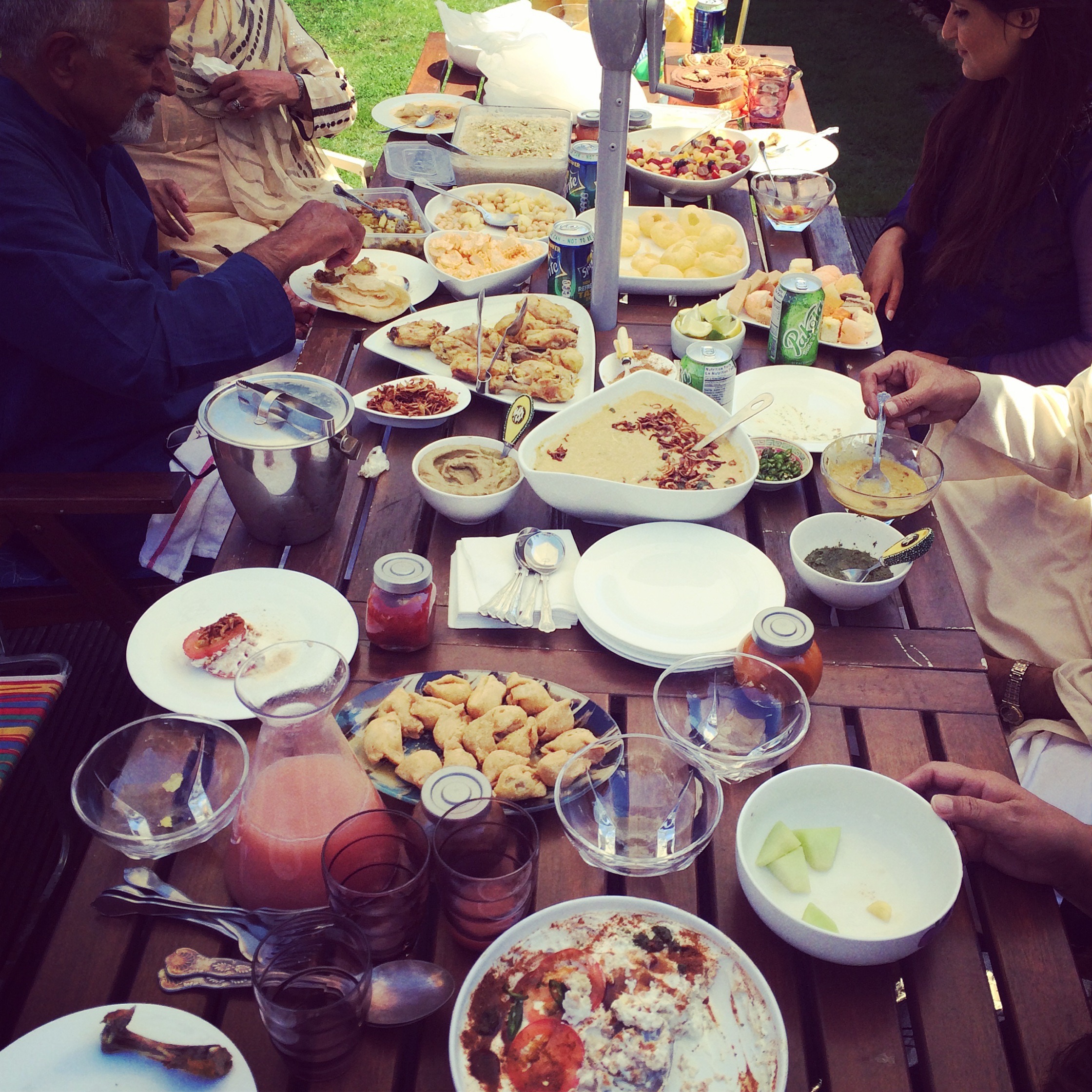 The Family Socials - Sharing platters of food around a table together
